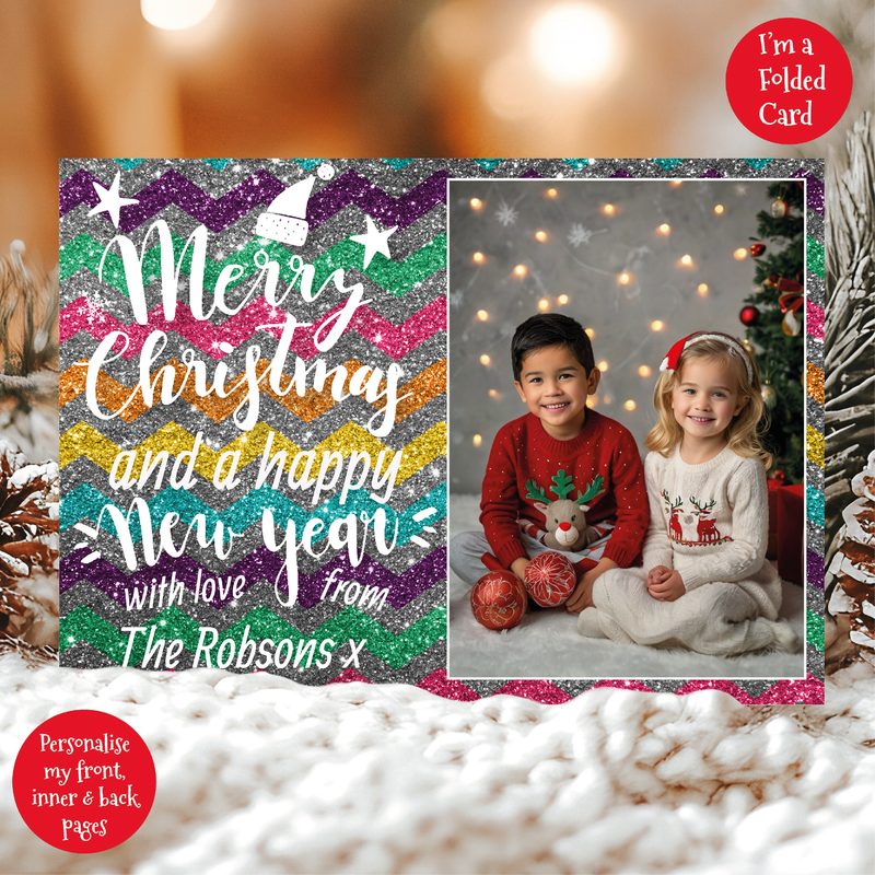 a couple of kids sitting next to a christmas card