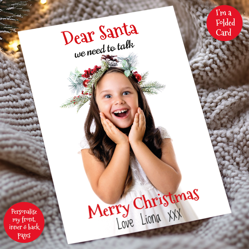 a christmas card with a picture of a girl wearing a wreath