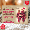 a christmas card with a picture of two children