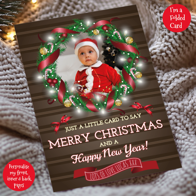 a christmas card with a photo of a baby