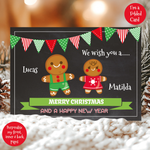 a christmas card with two gingerbreads on it