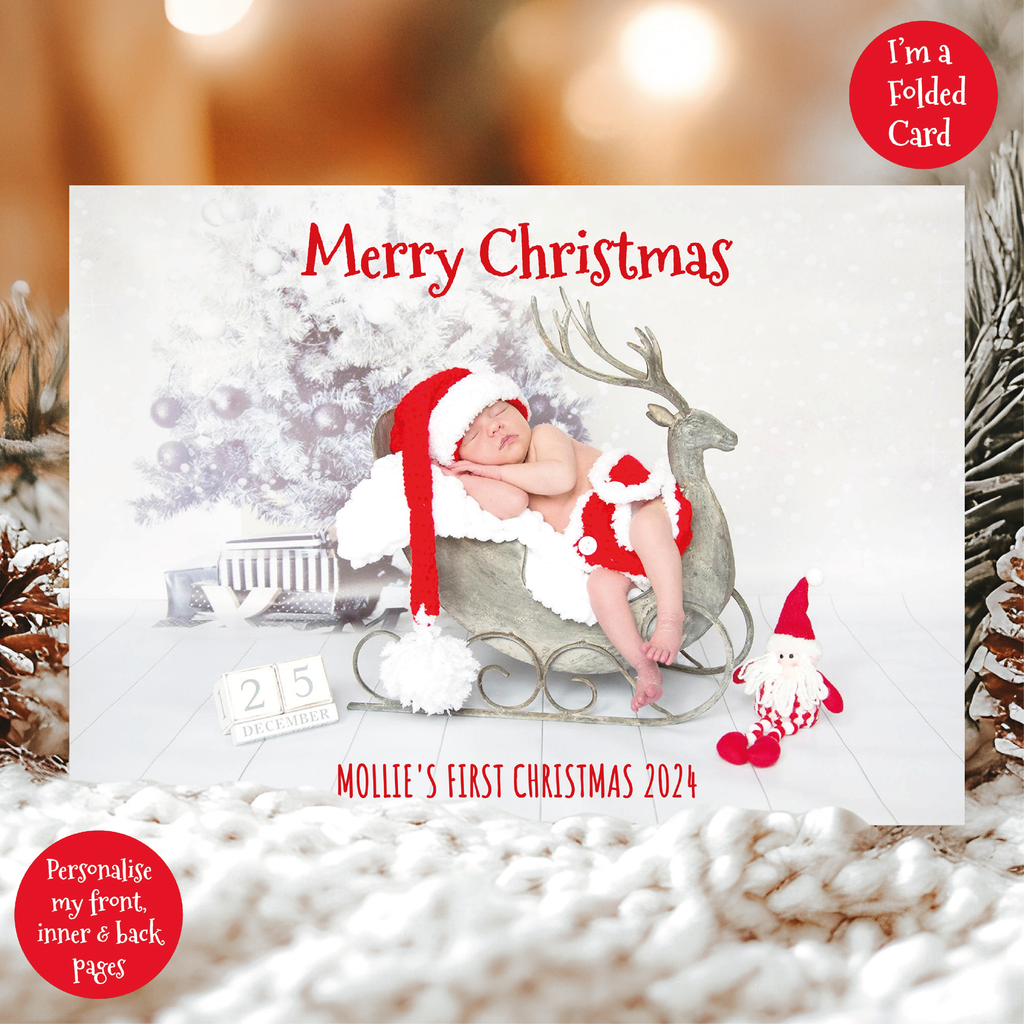 a christmas card with a baby in a sleigh