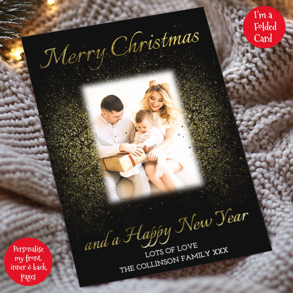 a christmas card with a picture of a couple holding a baby